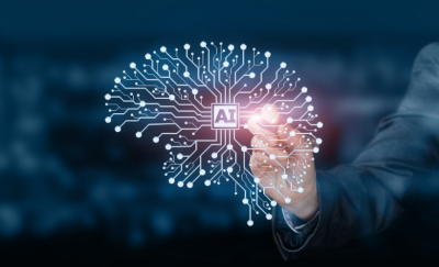 Person pressing on the letters AI - Artificial Intelligence